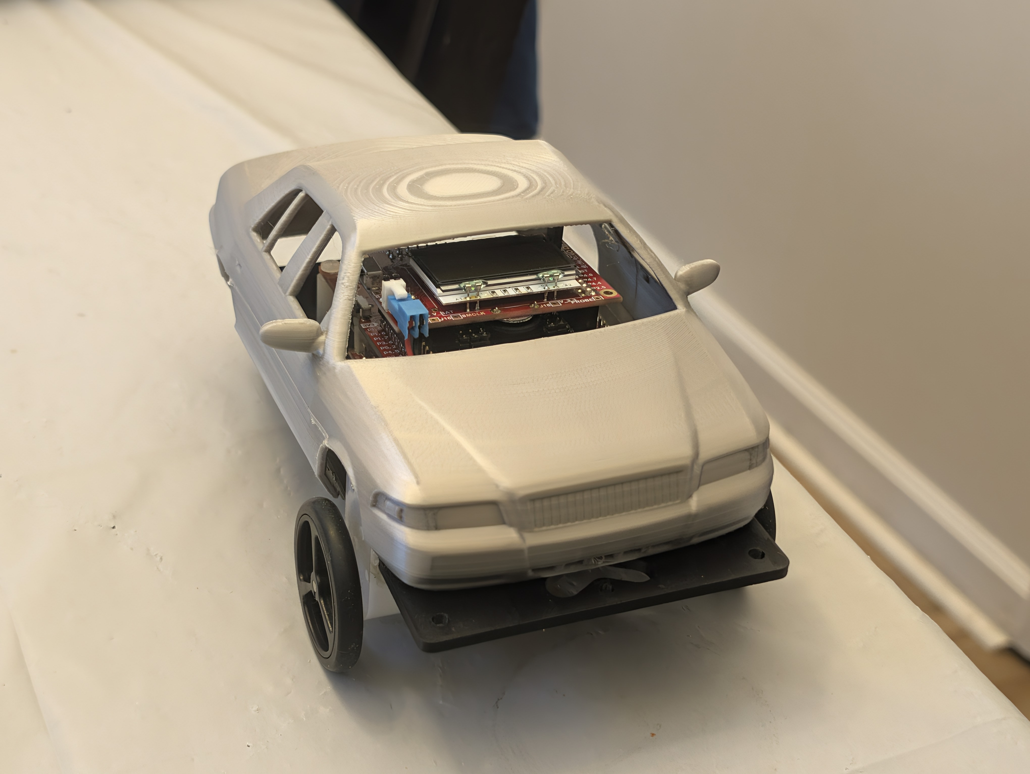 /assets/306carcloseupbutwitha3dprintedsilvergrandmarquisshellorhaton.jpg