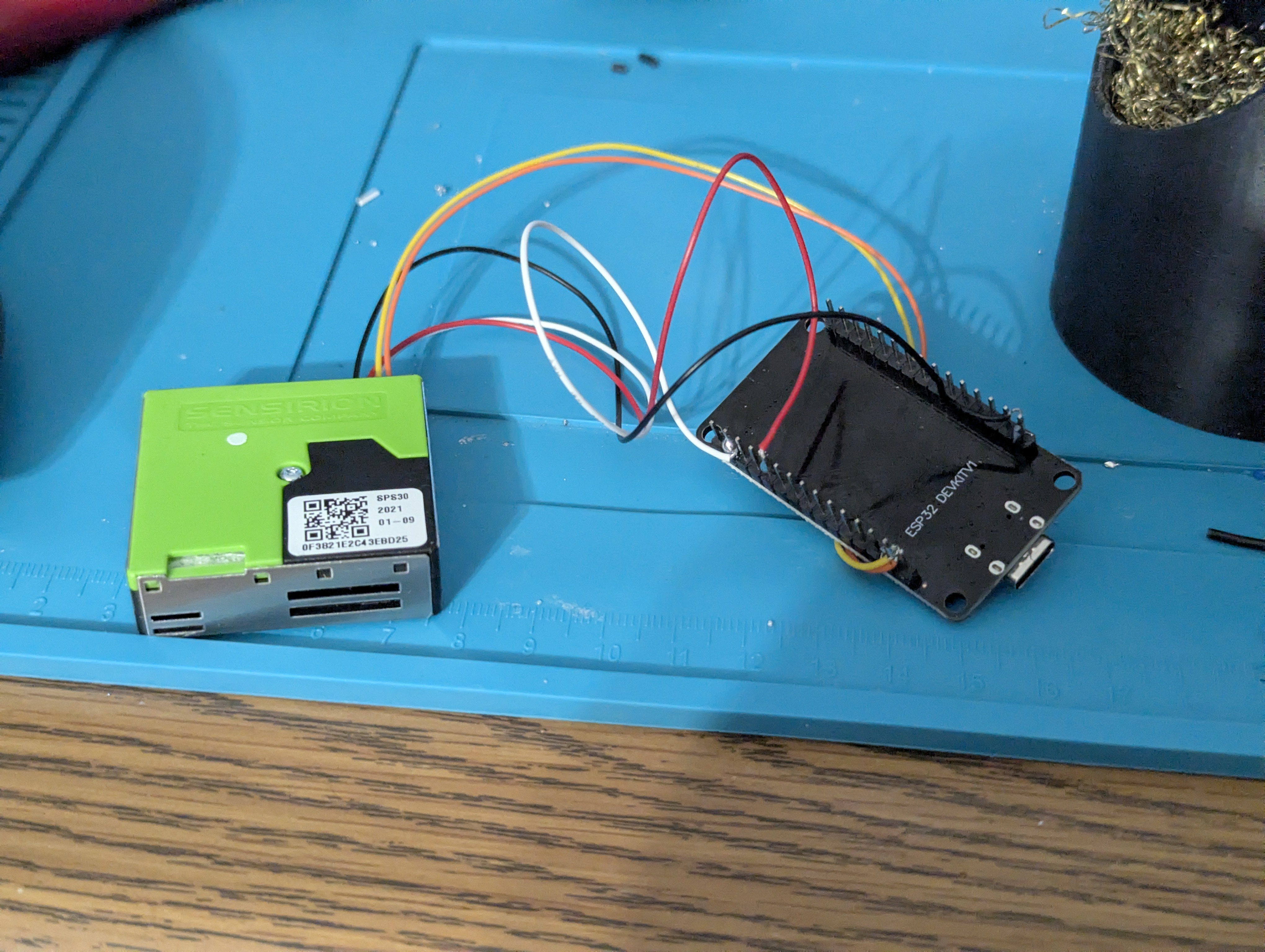 /assets/particlesensorsolderedtoesp32butnohousing-ondesk.jpg